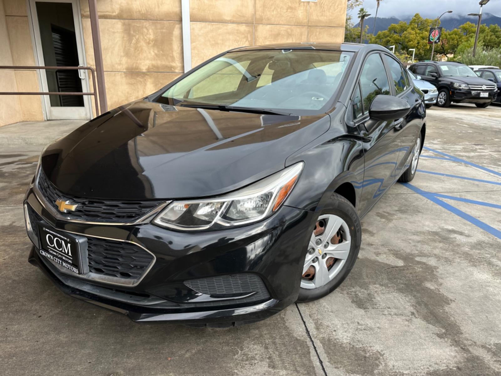 2017 Black /BLACK Chevrolet Cruze LS Auto (1G1BC5SM6H7) with an 1.4L L4 DOHC 16V TURBO engine, 6A transmission, located at 30 S. Berkeley Avenue, Pasadena, CA, 91107, (626) 248-7567, 34.145447, -118.109398 - Crown City Motors is a used “Buy Here Pay Here” car dealer in Pasadena CA. “Buy Here Pay Here” financing, means that when you purchase your vehicle from our dealership, that you make the payments to the dealership as well. We do not need the banks approval to get you approved for a used auto - Photo #0